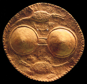 beaten gold pendant with female breasts