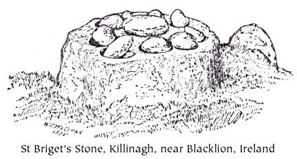 flat boulder with round riversstones on top