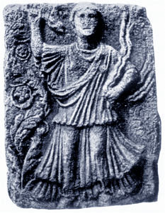 stone relief of dancing woman with snakes