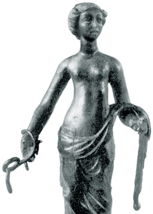 woman barebreasted holding coiling serpents, in bronze