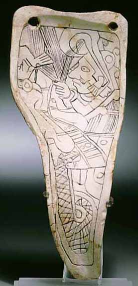carved shell with human figure